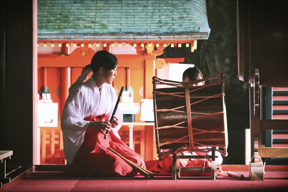 A musician playing a bamboo flute at Udo Jingū shrine